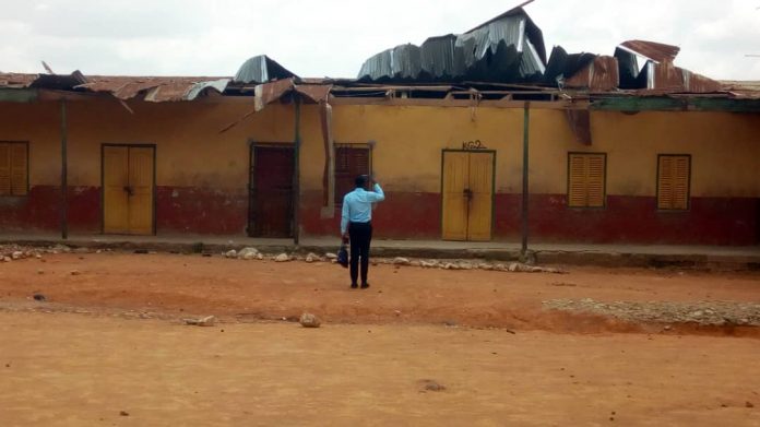 A NADMO official assessing the situation at the school after a Daily Mail Gh's report on the structure