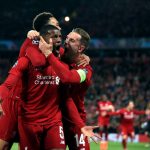 Liverpool's Georginio Wijnaldum, center, celebrates scoring his side's third goal of the game on Tuesday. (Peter Byrne/PA via AP)