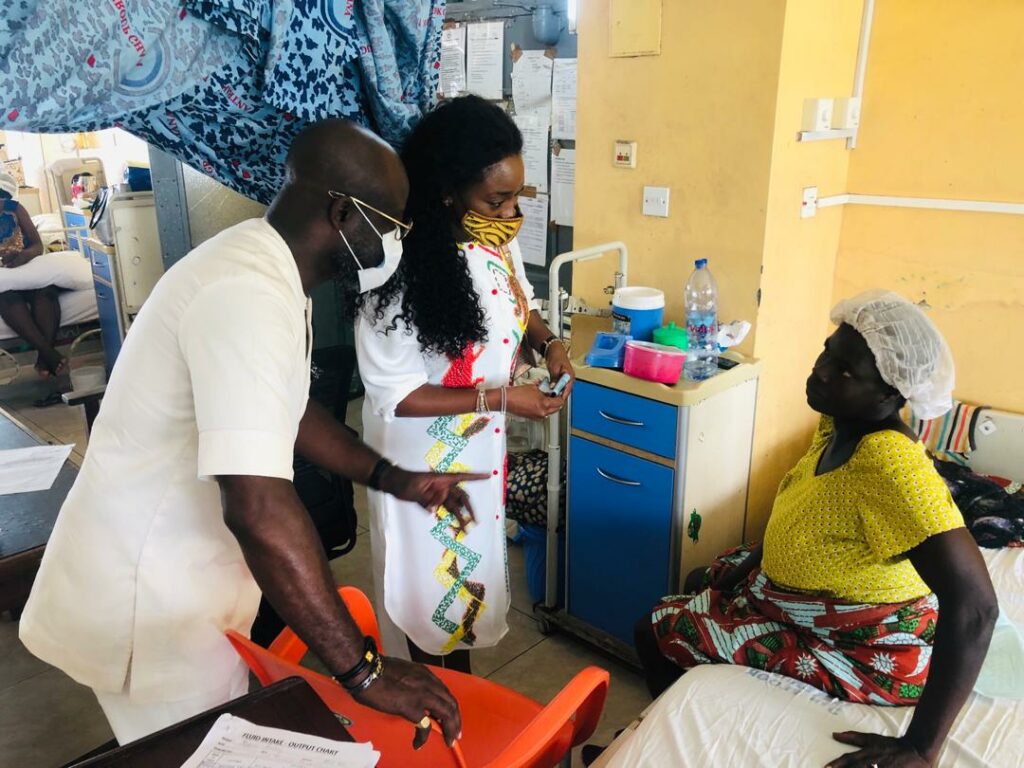 Nana Asante Bediatuo and wife interacting with a patient