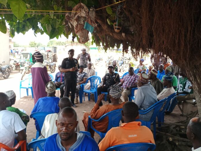 Ashanti Regional Police Commander interacting with the bereaved family