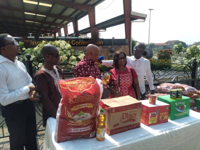 Pastor Ransford Obeng presenting the items to members of the Ghana Blind Union